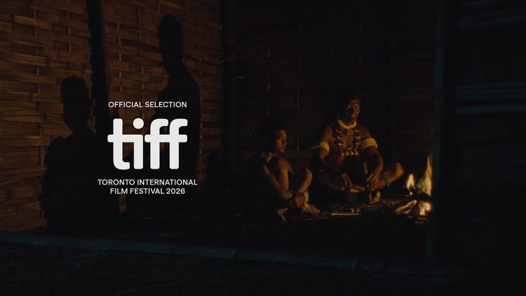 A firelit scene from Angh (2026), with the TIFF Official Selection laurel overlaid