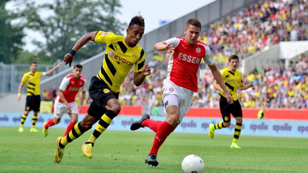 Footballer Pierre-Emerick Aubameyang running with the ball during a match
