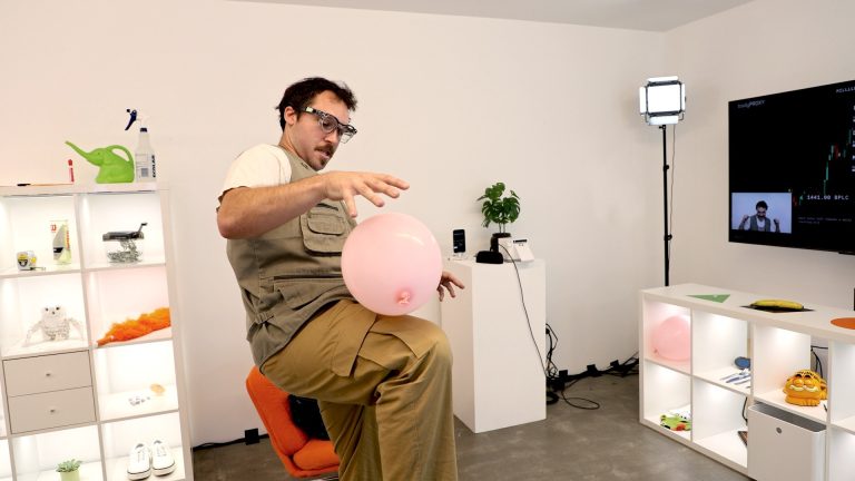 A participant in the Body Proxy AI installation at TIFF Innovation Hub wearing AI smart glasses