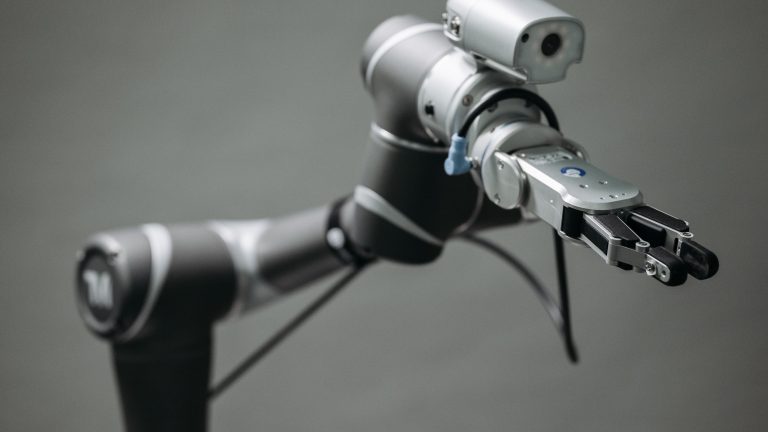 Close-up of a robotic arm with a mounted camera sensor